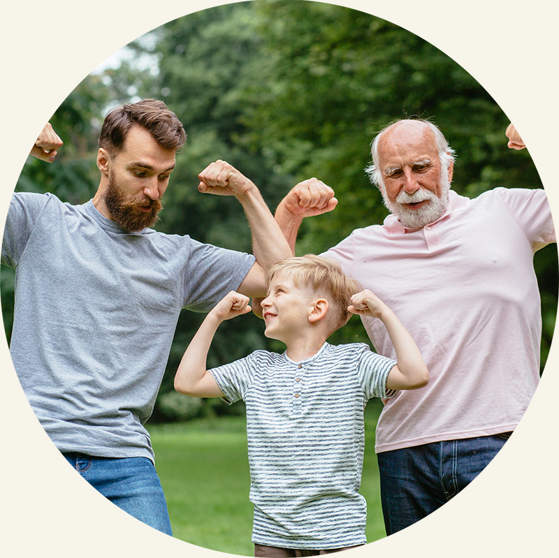 middle aged man, child, and elderly man showing muscles