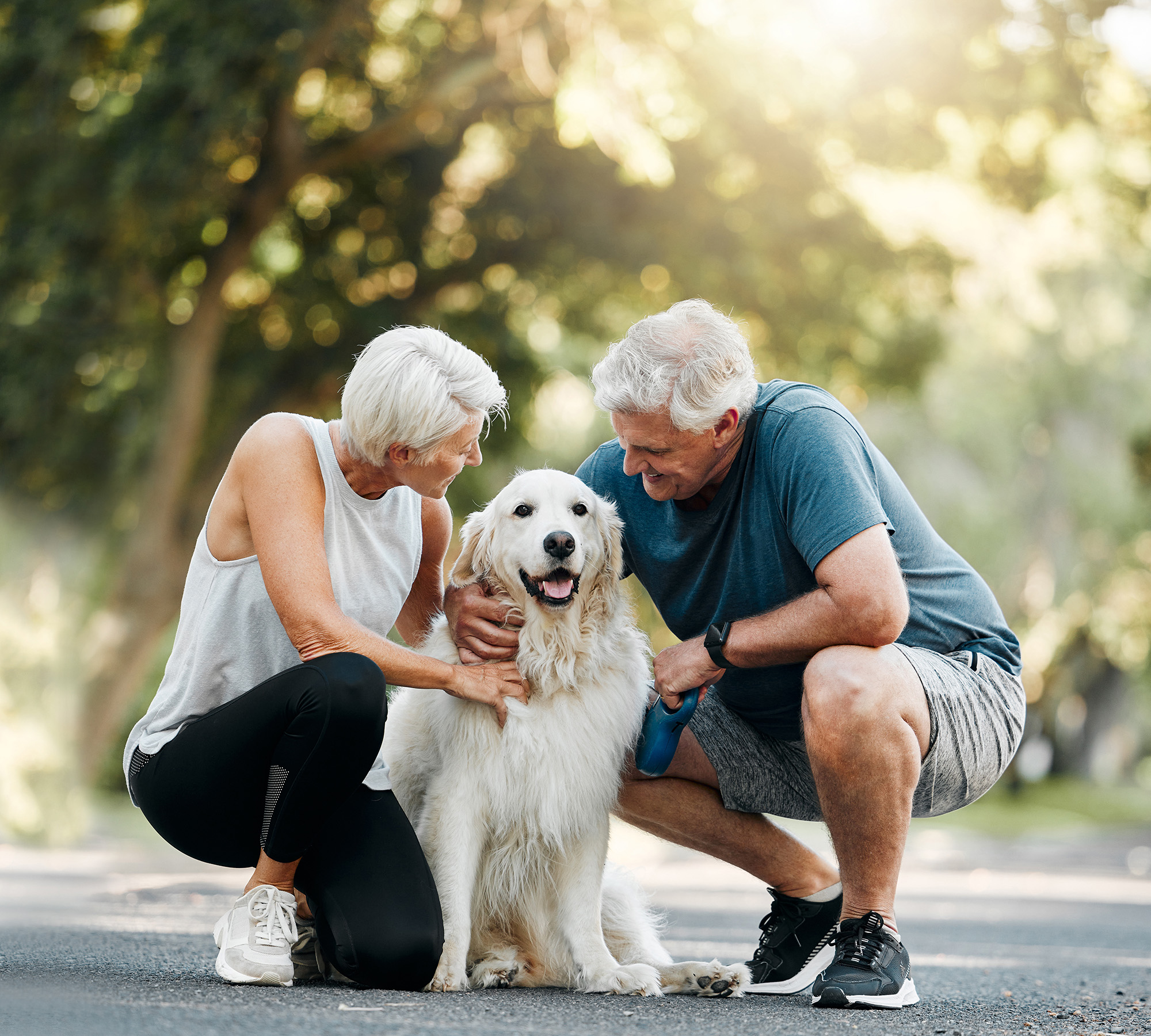 older couple with dog in nature